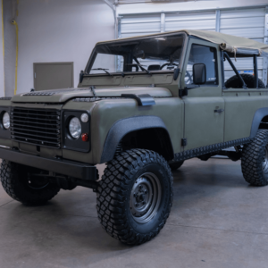 This is an exceptionally well-sorted and restored 1990 Land Rover Defender 110, brought to you by Defender Imports.  This is a former military Defender (Ex-MOD) that was previously used by the Netherlands Armed Forces.  After the truck arrived at our shop, we performed a 300-point bumper to bumper inspection, that included an additional 200 hours of restoration and service. The vehicle is mechanically sound and is ready for immediate use as a daily driver or dedicated trail rig. This build is focused on offroad capability, rugged aesthetic with purpose-built features, while maintaining the look and patina of a classic Ex-MOD. This is a clean and reliable daily driver with matching numbers. The vehicle is powered by a 3.5L Rover V8 engine with an Edelbrock upper manifold and FiTech electronic fuel injection.  The engine is paired with an LT85 5-speed manual transmission and an LT230 transfer case with locking center differential. The engine cold starts without issue and with the addition of electronic fuel injection it runs smoother and performs better than ever before. The engine had 299,790 original kilometers (186,280 miles) upon arrival to the US. During the restoration of this truck, we replaced the speedometer so it now reads in MPH. The new odometer currently has 22 miles on it. The vehicle looks great, drives great and is ready for your next adventure.